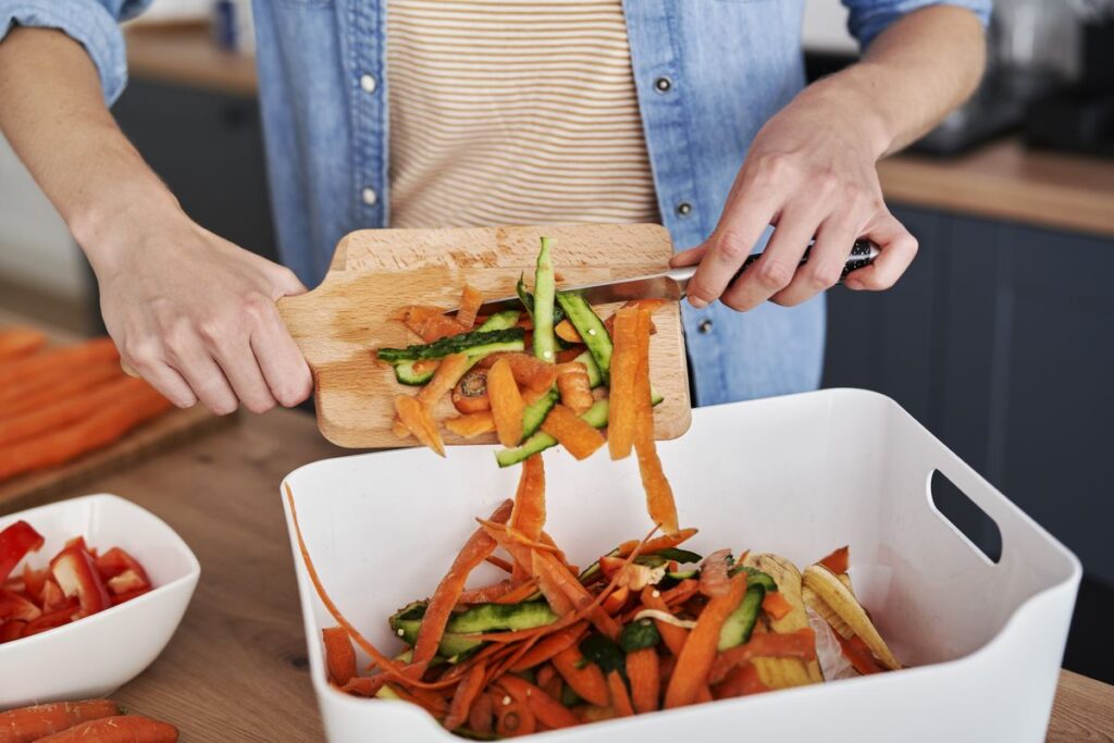 throwing away organic waste into the bin