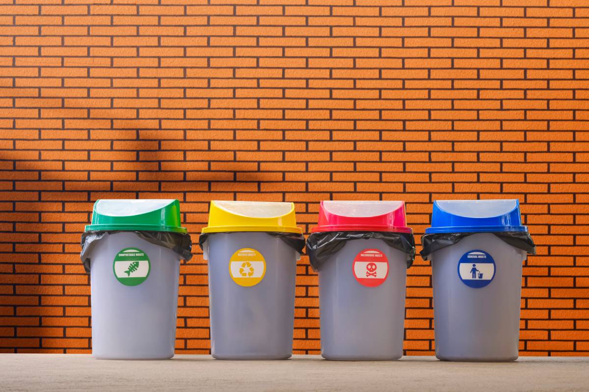 multi-colored-garbage-bins-on-pavement-with-blurre-2025-03-10-17-28-53-utc (1)